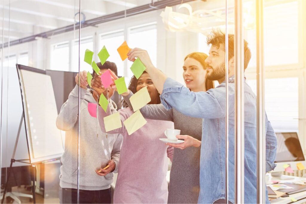 Employees building emotional intelligence and resilience in team workshop