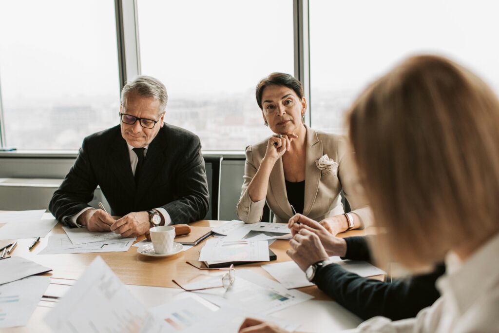 Leader sitting at a desk in a high-pressure moment, illustrating leadership under pressure